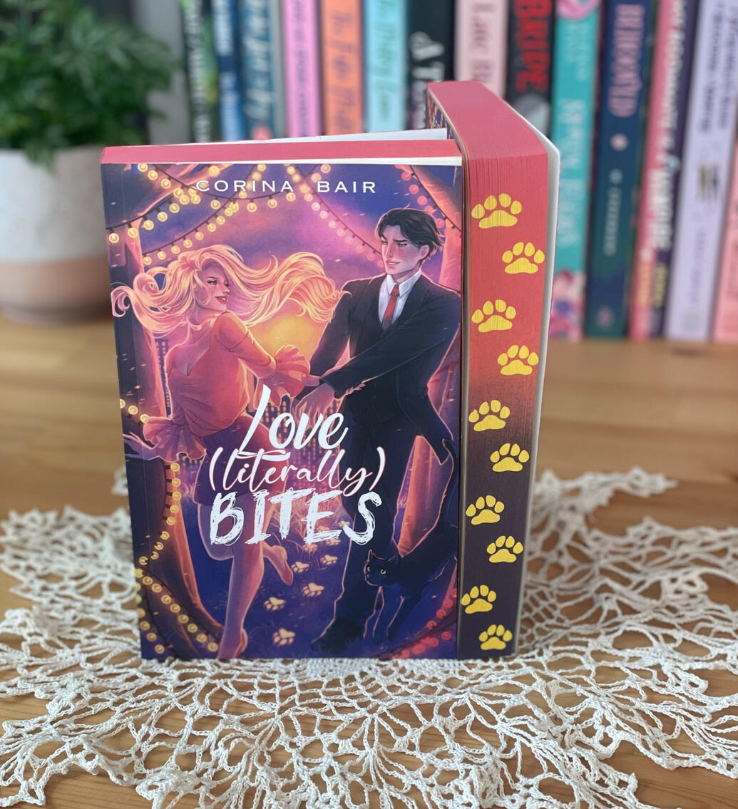 Logo A logo saying "Corina Bair" "Romance Author" in pink and blue with lavender sparkles